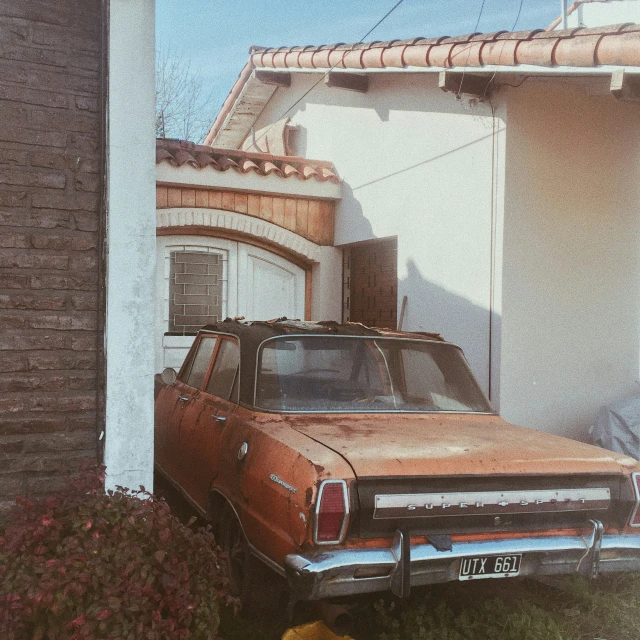 a car parked on the side of a house