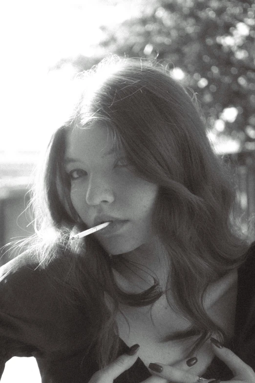 a beautiful woman with long hair is sitting