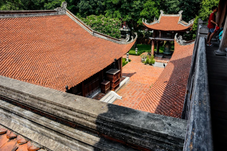 an aerial view from the top of a building with a view of trees and buildings