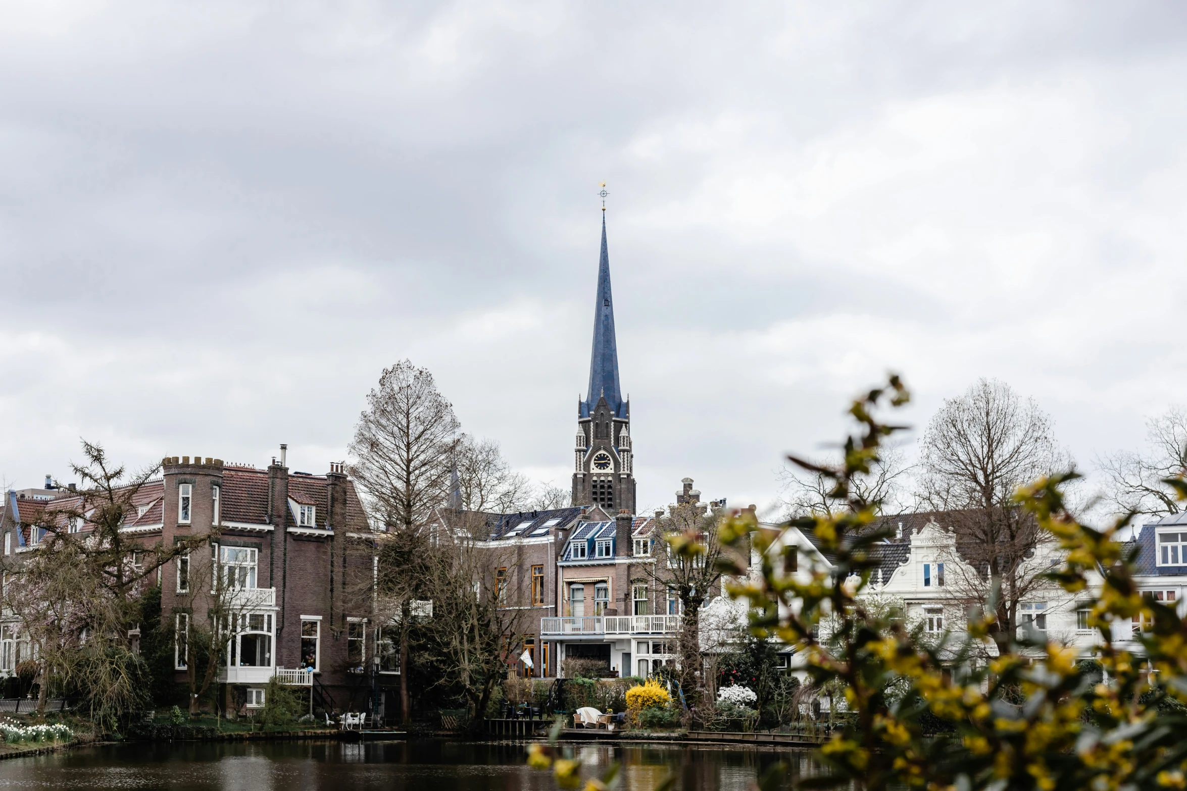 a clock tower that is next to a body of water