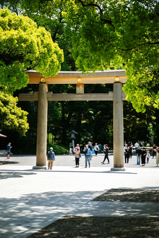 a big wooden structure sitting in the middle of a park