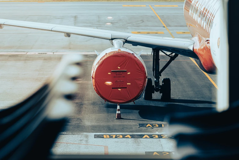 the view from inside a plane that is red on the outside