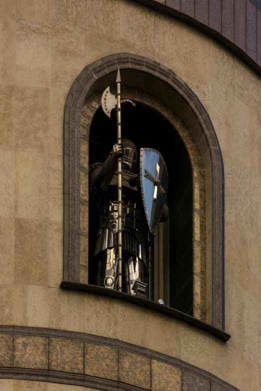 the reflection of a clock on a building's face