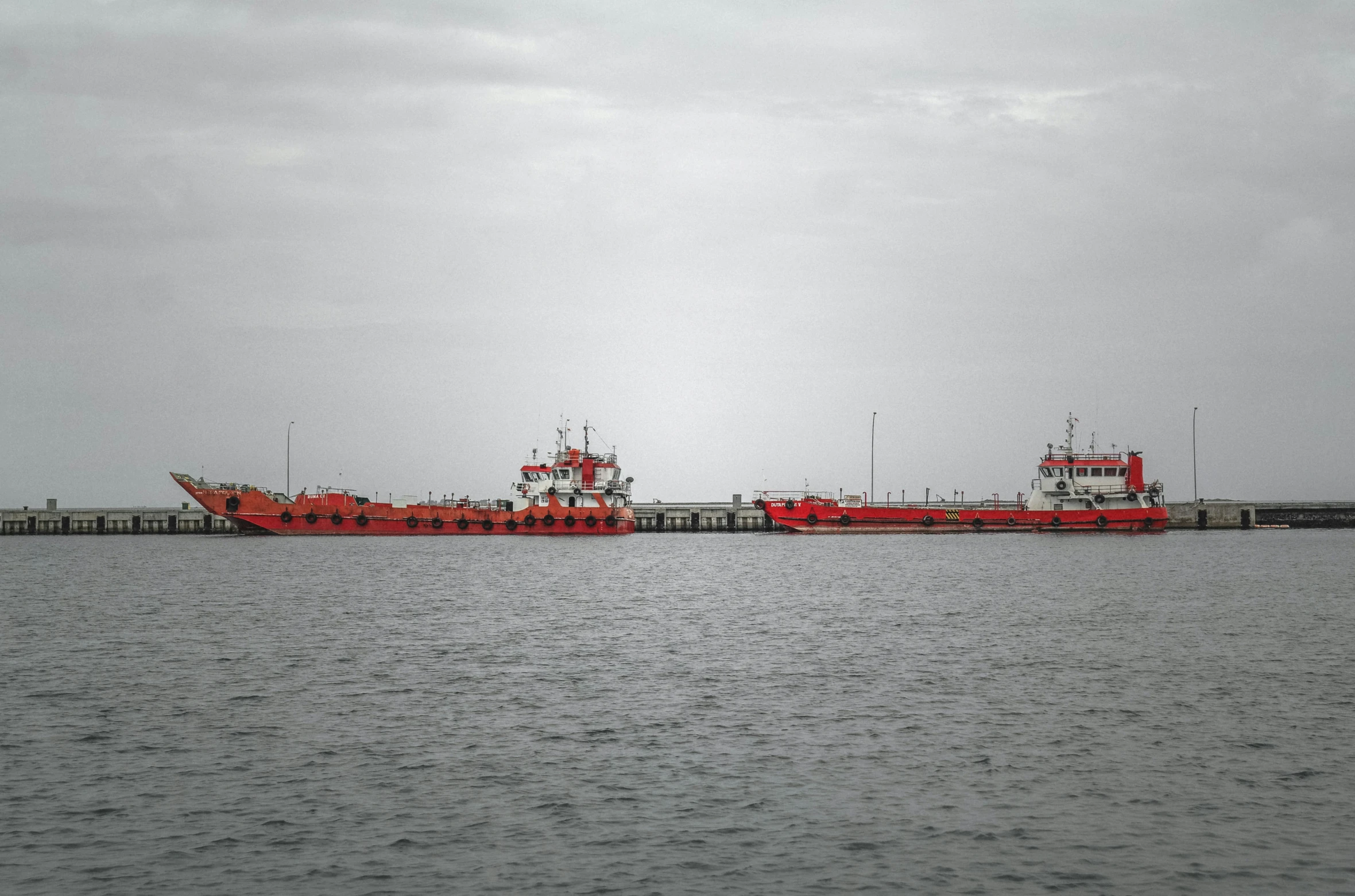 a large ship sits in the middle of the water