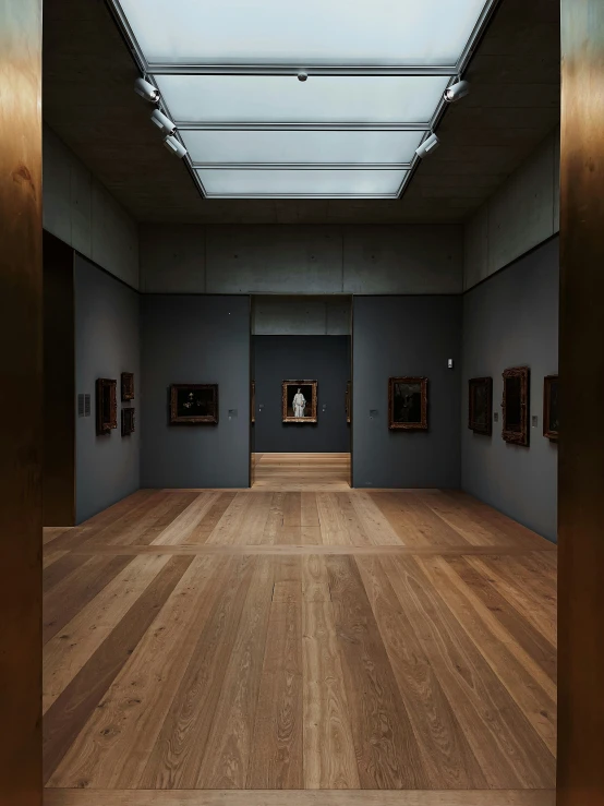 a large room that has many paintings on the wall