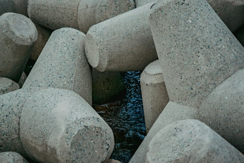 several gray rock formations with water in the middle