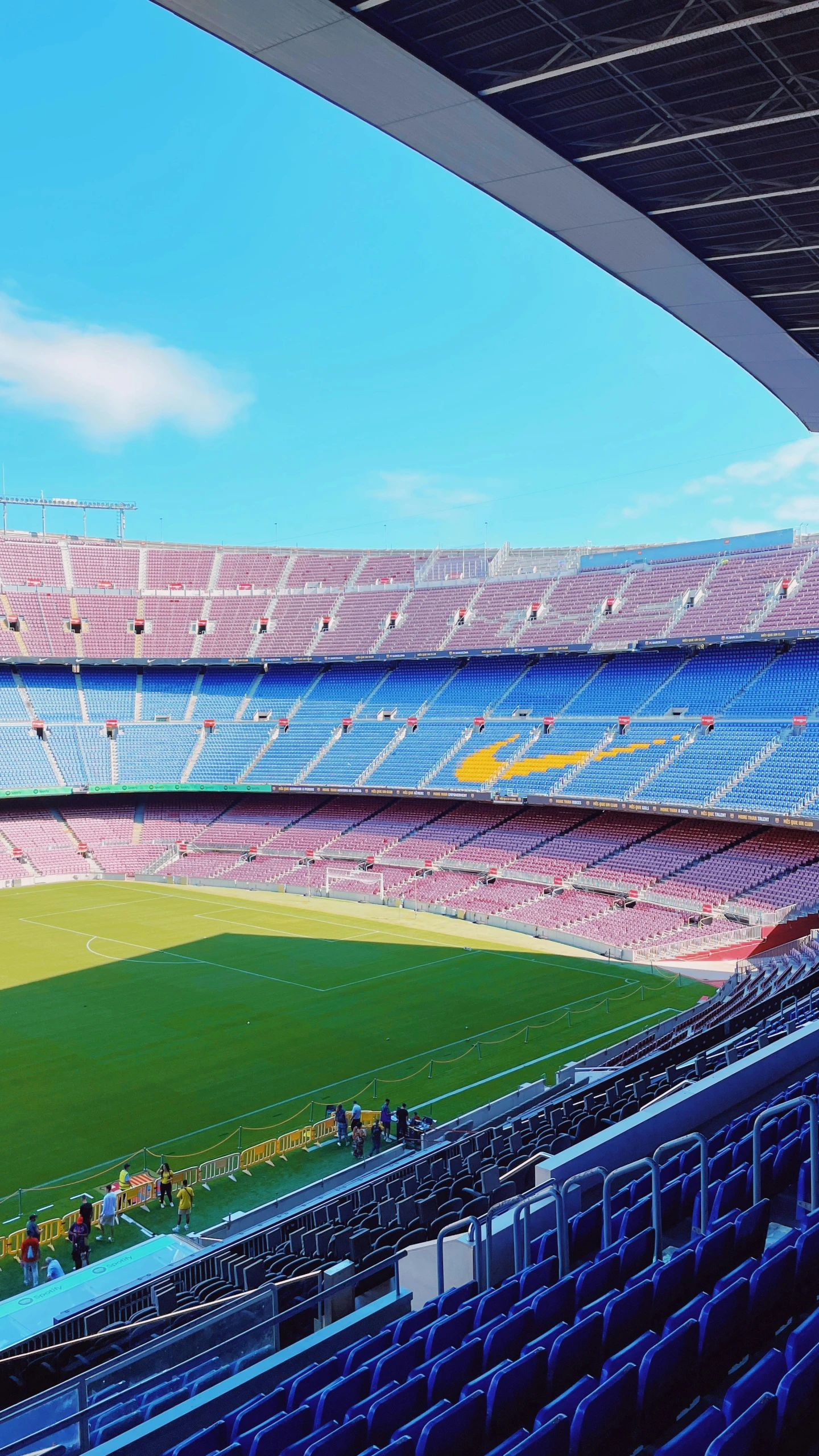 a soccer field sits empty inside a stadium