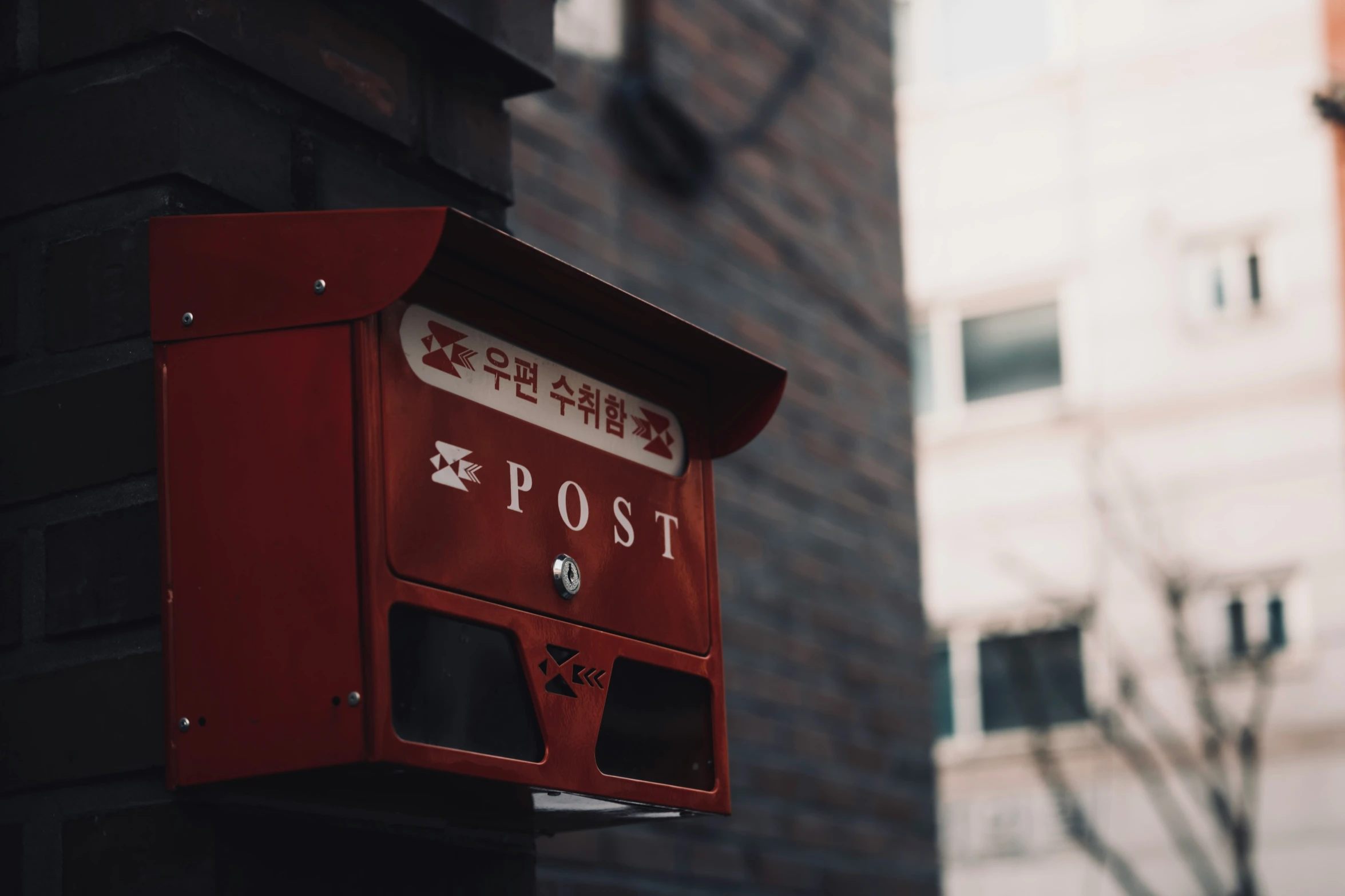 a mail box attached to the side of a building