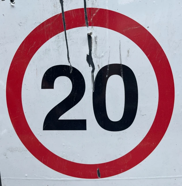 an image of an old road sign that is painted red and white