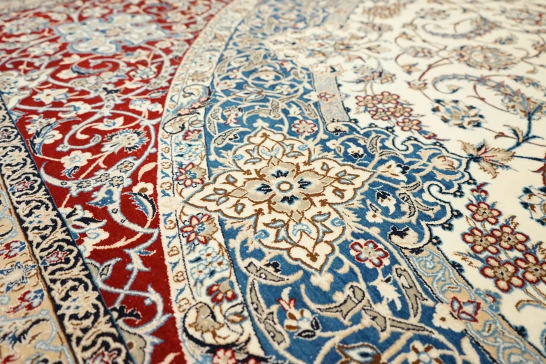 a large red and blue rug on the floor