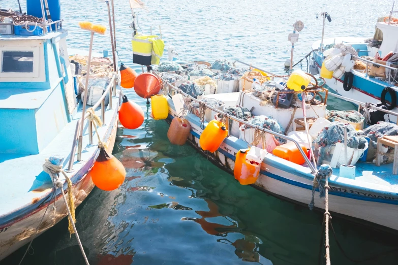 some small boats in the water near each other