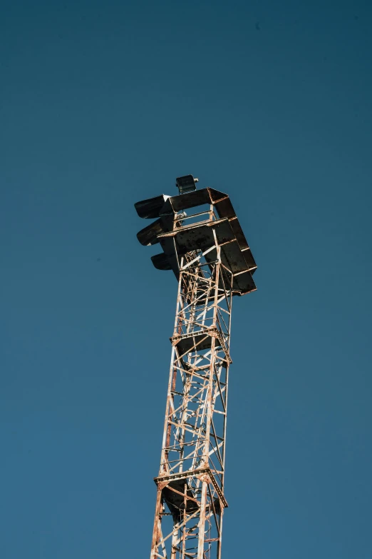 a ladder reaching up into the sky is shaped like a clock