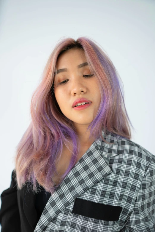 an asian female with a pink - haired bob haircut