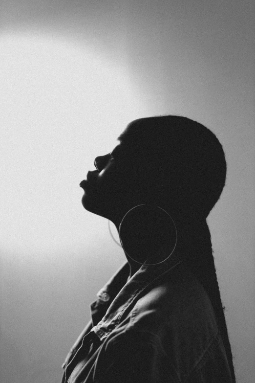 a black and white po of a person wearing ear buds
