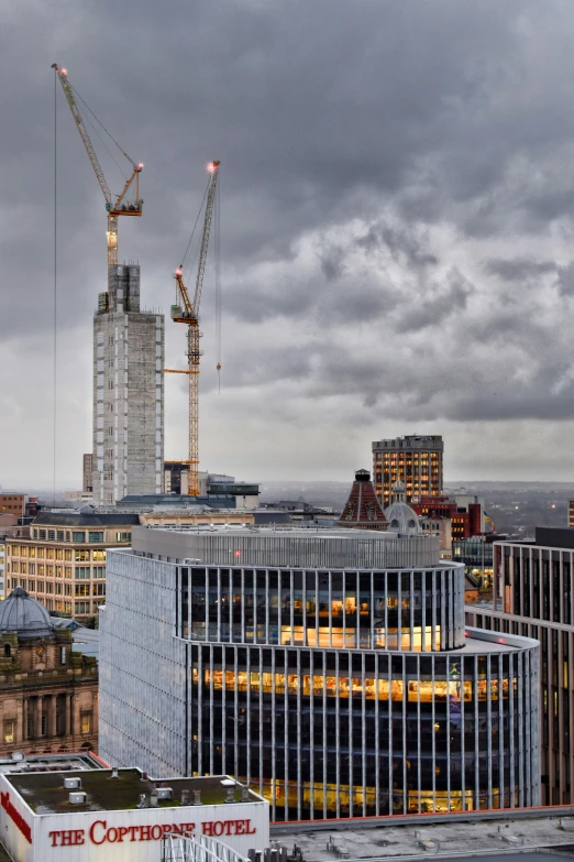 the large skyscrs under construction on a cloudy day
