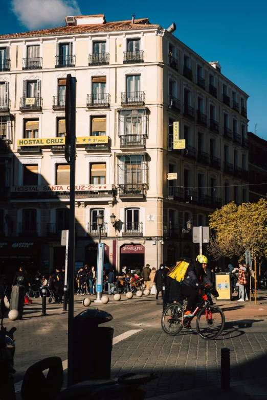 a bike is parked along the street in front of some large buildings