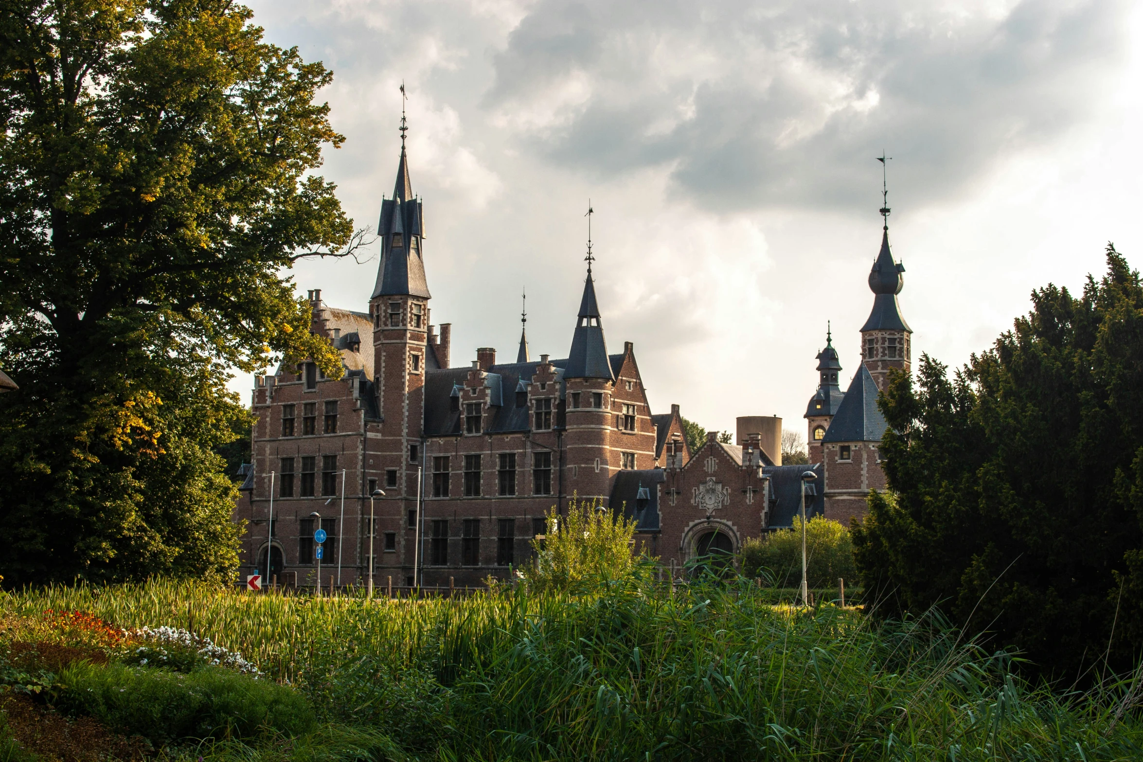 a view of an old castle from across the pond