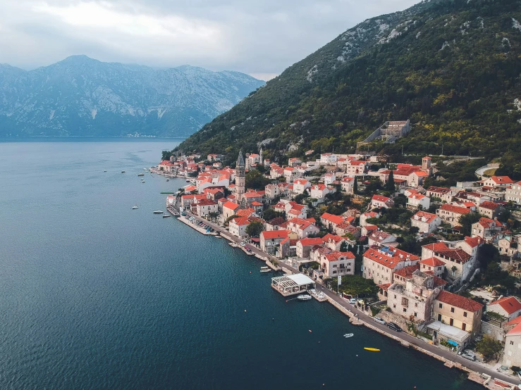 view of a large town nestled along the coastline