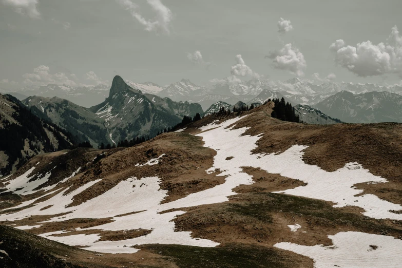 mountains and snow covered rocks on the sides