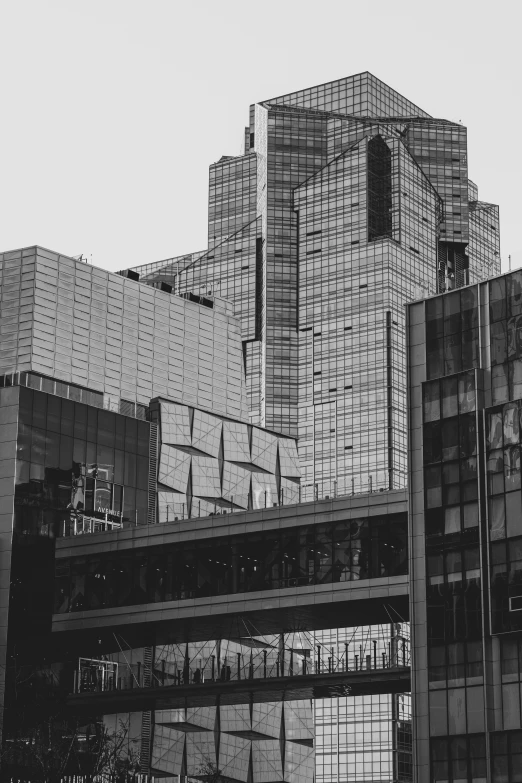 black and white image of cityscape showing a building covered in scaffolding