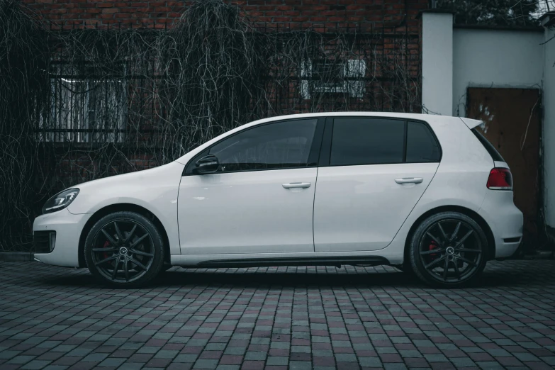 the front of a white volkswagen golf