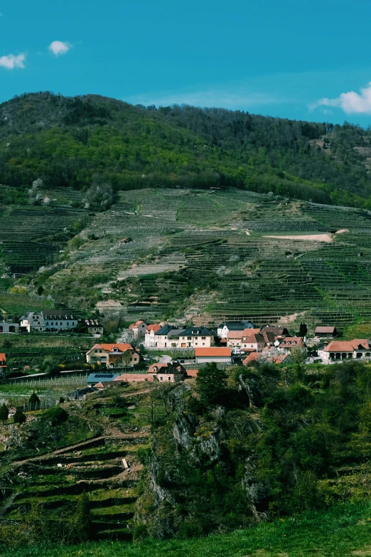 a rural landscape is seen on the top of a hill