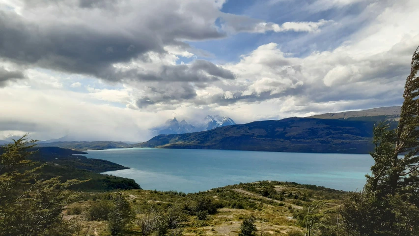 a lake and some mountains in the distance