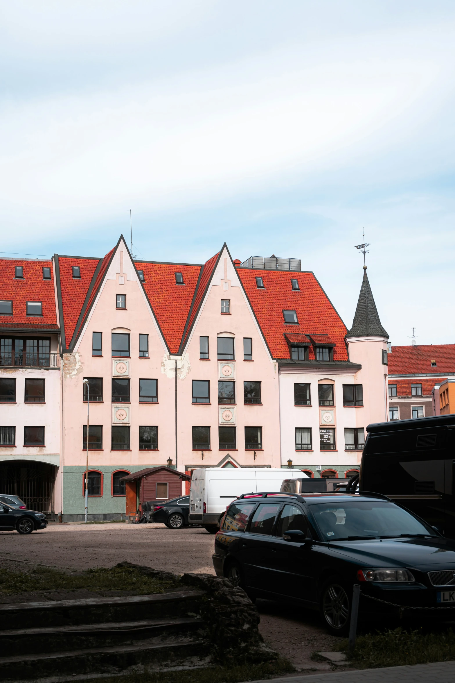 a row of large pink buildings next to each other