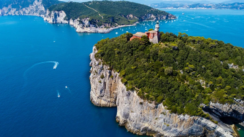 an island is surrounded by water and rocks