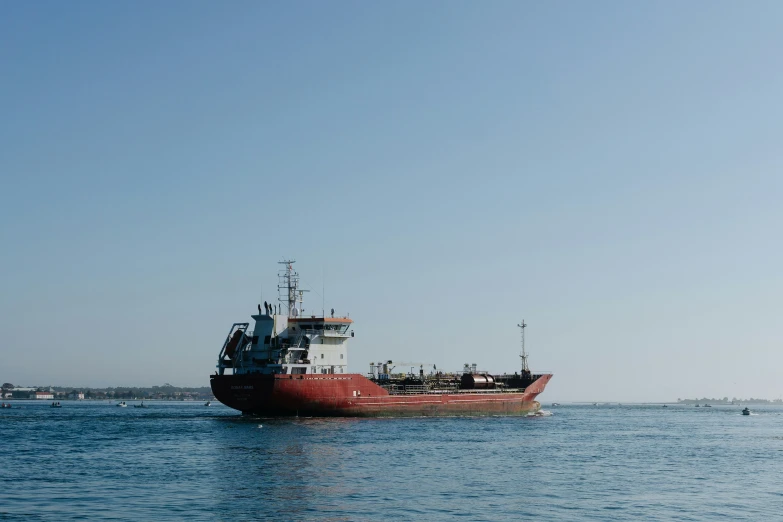 a tug boat is moving through the ocean