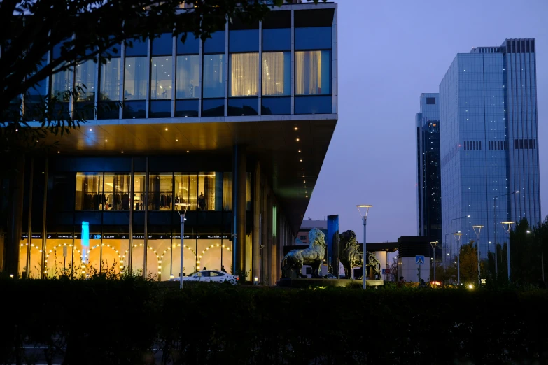 an urban city at dusk with many lit up buildings