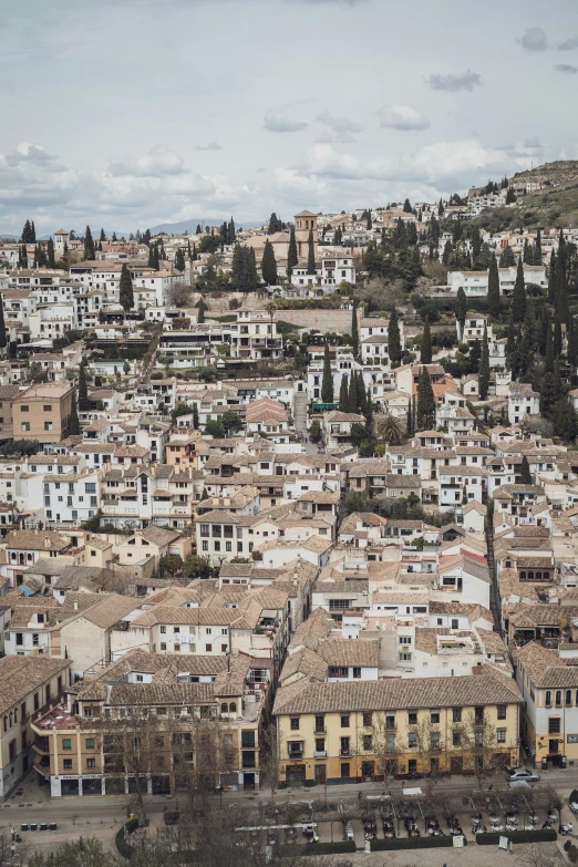 a city from above with many houses in the distance