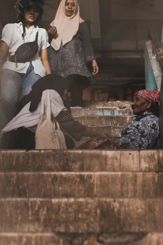 two women stand on the steps and look in the opposite direction