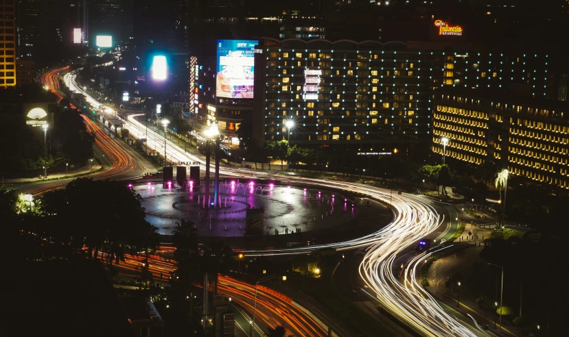 a cityscape with street lights and building at night