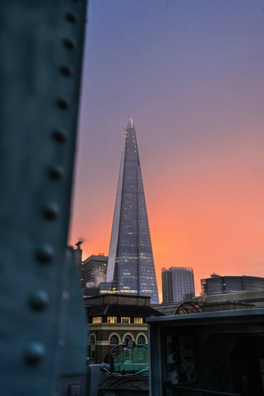 a tall tower near a city in the distance