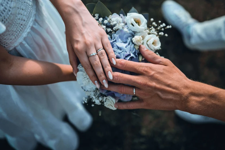 wedding guests holding the bouquets and hands