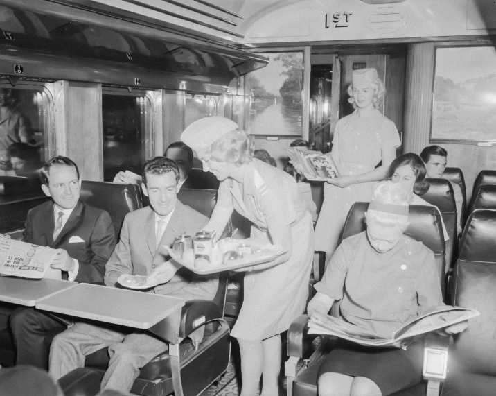 a black and white image of people wearing airline uniforms