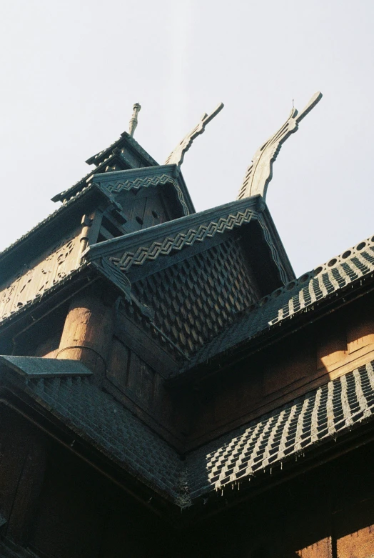 the top portion of a large asian style building