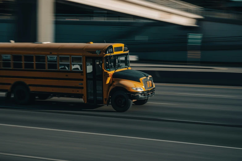 a school bus rides down a busy street