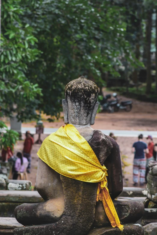 there is an image of a statue with a yellow ribbon around it