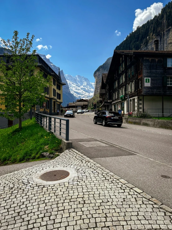 the street in front of the buildings has a sidewalk