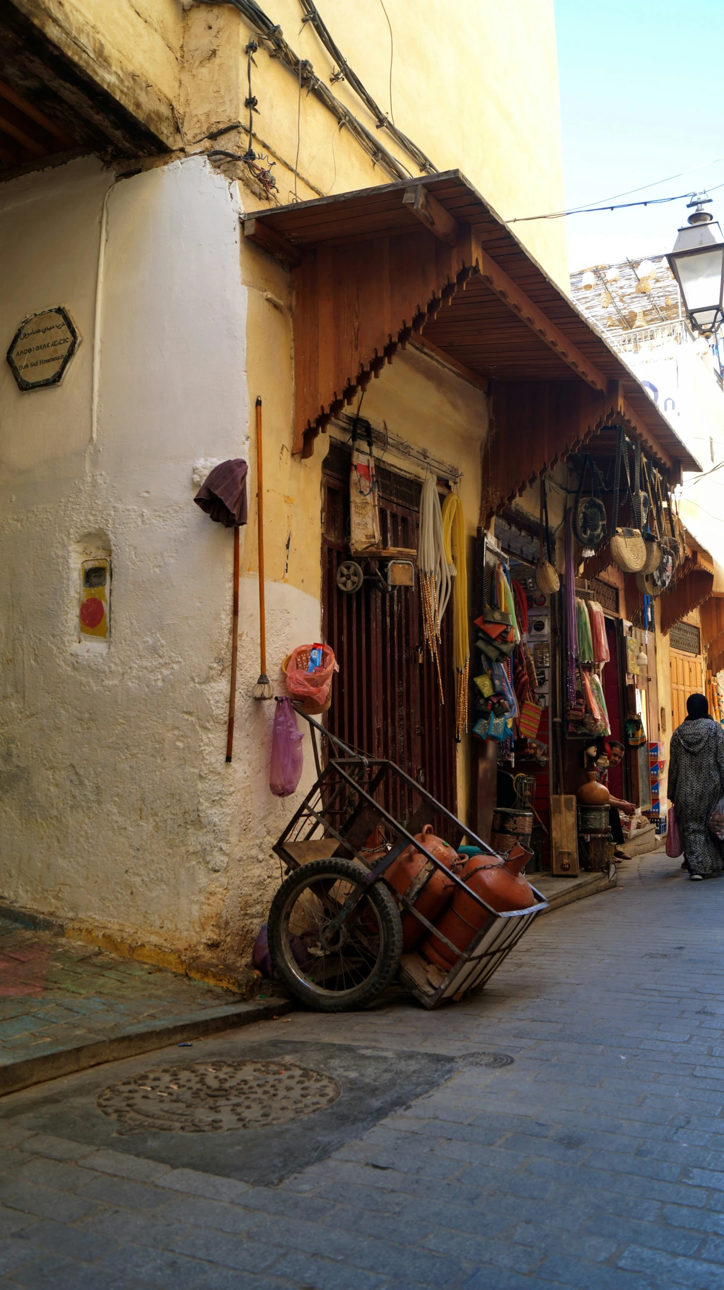 the back of an old shop with a bike in front