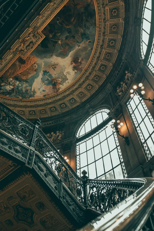 several large windows in an ornate, round building