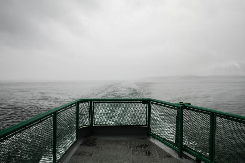 a view over the ocean and fog on a boat