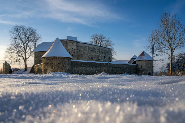 a building in the middle of winter with snow on it