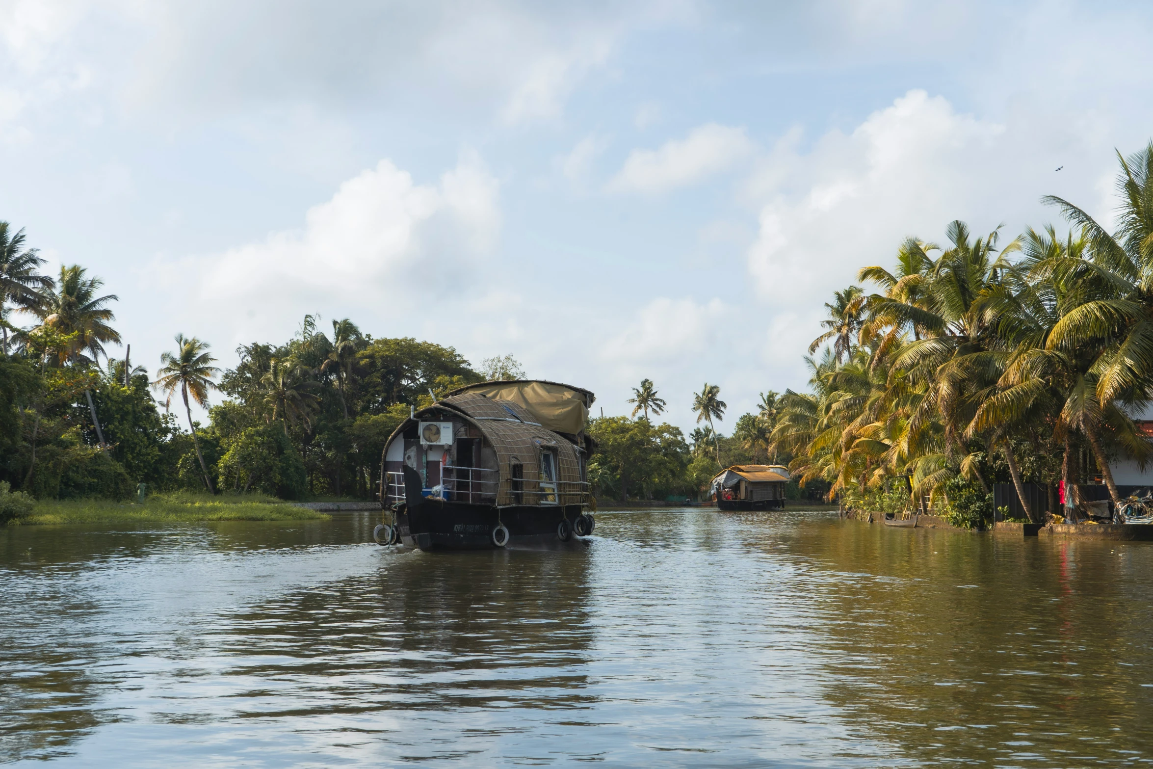 a river with a house boat that is in it