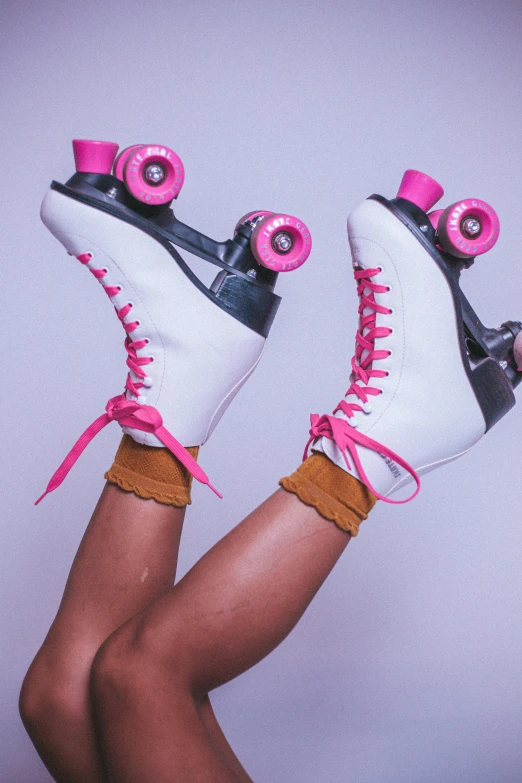 a pair of white and black roller skates