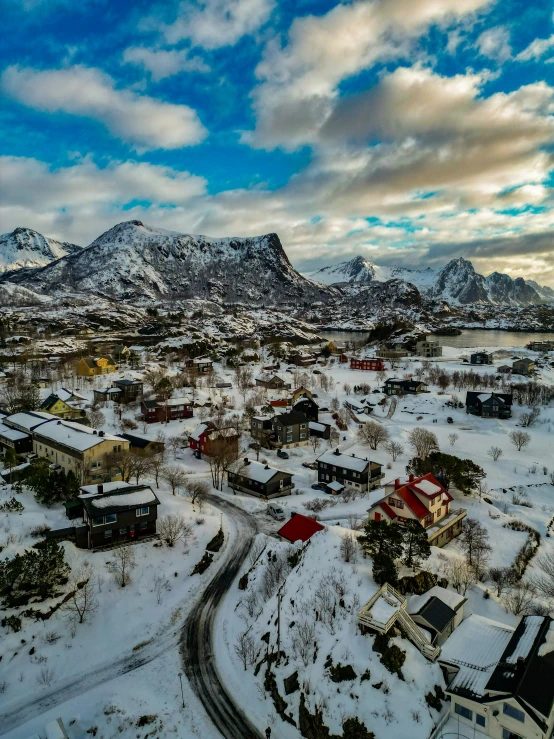 a town in the mountains is covered in snow