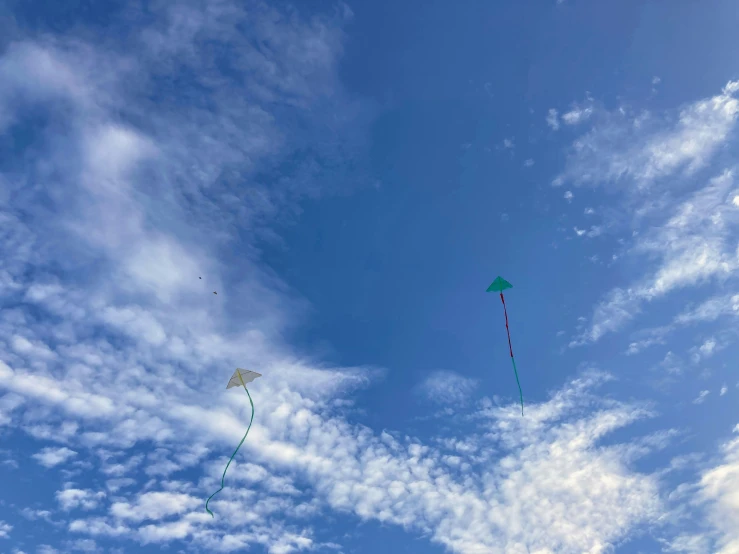 a couple of kites flying in the air