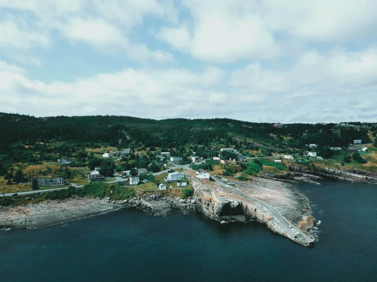 a po of a coast with a rock in the middle